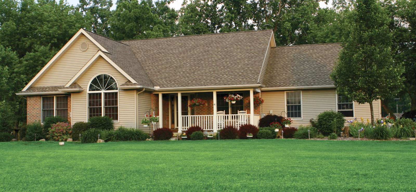 A picture of a house and front lawn