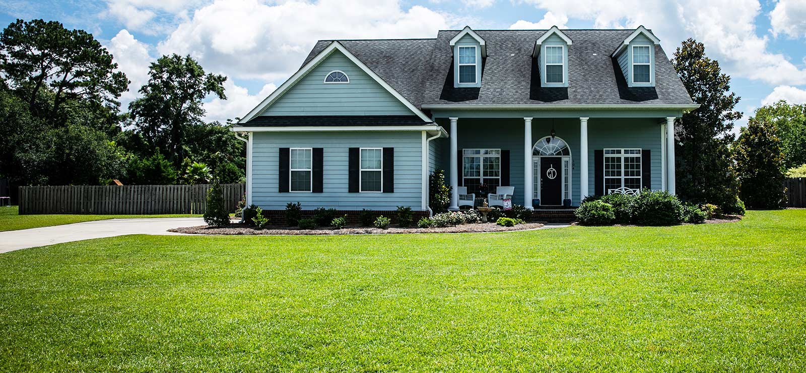 A beautiful house with a glorious green lawn